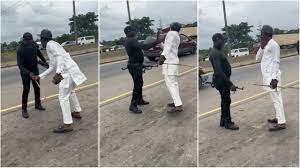 Watch the angry moment a police officer was caught on camera assaulting a man in Port Harcourt